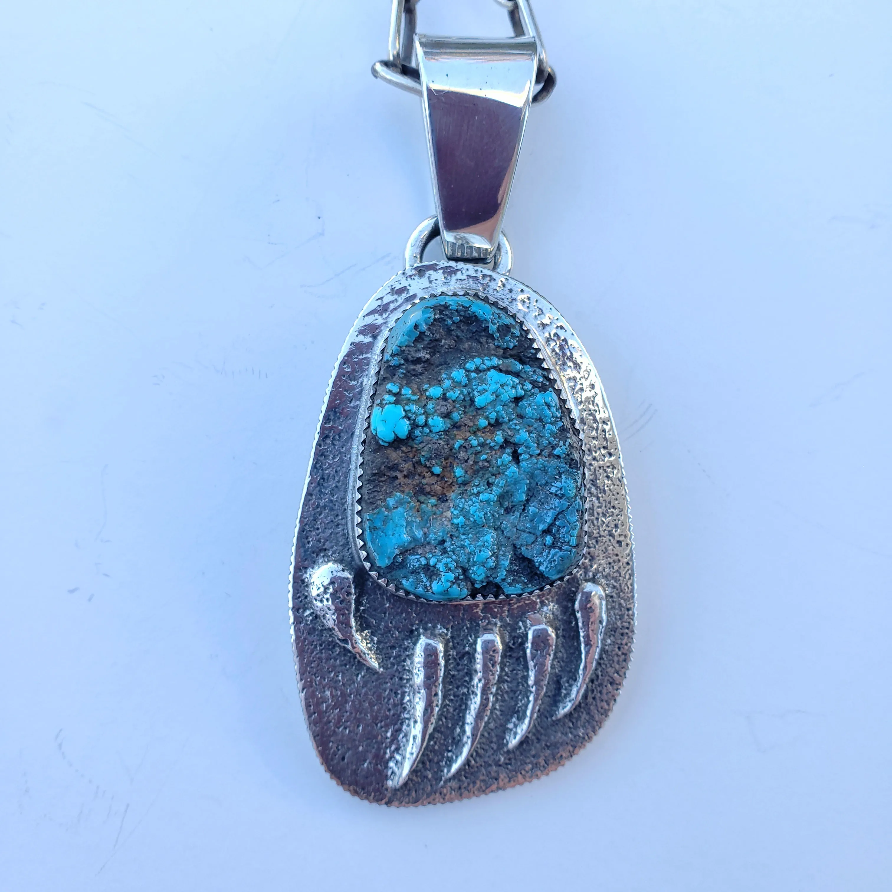 Tufa Cast Bear Track Pendant with Morenci Turquoise Nugget